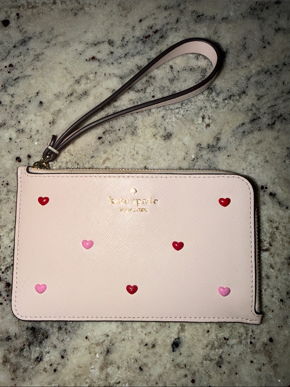 kate spade light pink wristlet with red and pink heart details